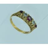 A five stone ruby and diamond Ring, the three graduated rubies with a diamond in between within