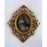 19thC School Young woman with book oval, oil on board, inscribed in ink verso 'Ellen Powell' 8½in