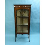 An Edwardian inlaid mahogany glazed Display Cabinet, on tapered legs.