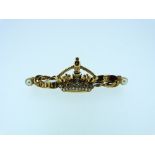 A 15ct yellow gold Brooch, in the form of a swallow with textured wing and body, ruby eye and