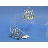 A pair of George V silver five bar Toast Racks, hallmarked London, 1911, of Gothic arch form on ball