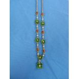 A charming Necklace, formed of five green enamel four leaf clovers, each centre with a seed pearl,