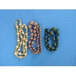 Three Glass Bead Necklaces, probably Murano, one with white beads with enamelled flowers, one with