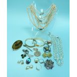 A collection of Costume jewellery, comprising two paste rings, brooches, two pairs of earrings,