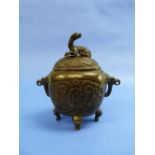 An antique Oriental bronze Censer, of two-handled ovoid form with decorative panels, the cover