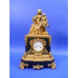 A French Empire-style ormolu and black marble Mantel Clock, the base with an 8-day movement striking