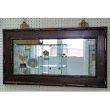 An early 20thC Chinese hardwood framed Wall Mirror, of rectangular form with brass mounting