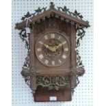 A Black Forest Cuckoo Clock, of carved architectural form, the case bearing a label for "Camerer,