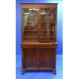 A William IV mahogany Secretaire Bookcase, with two glazed doors enclosing three shelves, above