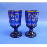 A pair of Bavarian blue glass Goblets, of octagonal form, with gilt scroll decoration, 6¼in (16cm)