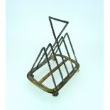 A Victorian silver five bar Toastrack, in the style of Dr. Christopher Dresser, by Henry Wilkinson &