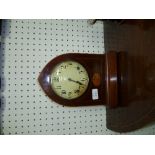 An Edwardian mahogany Mantel Clock, of Gothic arch form with inlaid fan decoration, the 8-day