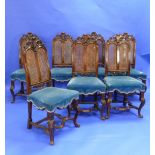 Seven antique continental carved walnut Dining Chairs, some marked 'E. Campbell' on the frame,