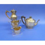 A near matched three piece Tea Set, by Walker & hall, hallmarked, Sheffield, 1909, 1913, 1914, of