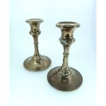 A pair of George V silver Candlesticks, hallmarked Birmingham, 1911, of octagonal form on circular