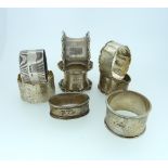 A pair of silver Napkin Rings, by Walker & Hall, hallmarked Sheffield, 1928, together with six other