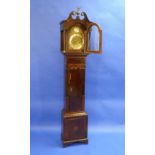 An early 19thC mahogany eight day Grandmother Clock, striking on a bell, the silvered chapter ring