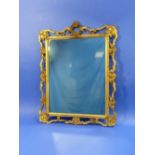 A Rococo-style giltwood, plaster and gesso framed wall Mirror, the rectangular plate mounted
