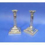 A pair of Edwardian Corinthian Column Candlesticks, by Walker & Hall, Hallmarked Sheffield, 1903,