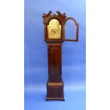 An early 20thC eight day mahogany Grandmother Clock, striking on a bell, the silvered chapter dial