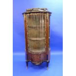 A Louis XVI style kingwood Vitrine, with double-serpentine shaped front, the whole decorated with
