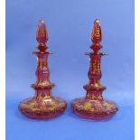 A pair of 19thC Bohemian ruby flash cut-glass Scent Bottles, of slender octagonal form on