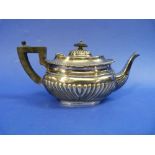 A Victorian silver Teapot, hallmarked Birmingham, 1896, with gadrooned border and demi fluted