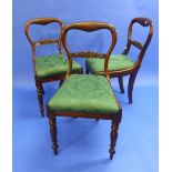 Three William IV rosewood balloon back Dining Chairs, with carved scrolling bar back and drop-in