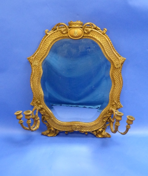 An antique giltwood framed gadroon shaped girandole Mirror, the frame with textured surface,