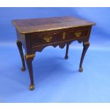An early 18thC oak Side Table, with a single drawer with brass handles and escutcheon, raised on