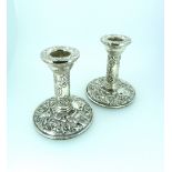 A pair of ornate silver dressing table Candlesticks, hallmarked Birmingham, 1994, chased with