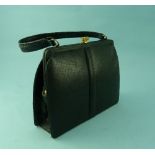 A black Crocodile Skin handbag, by Mappin & Webb Ltd, with gilt-metal clasp, 10in (25.25cm) wide.