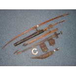 Tribal Weapons; a North African wooden bow and approx. twelve arrows, with steel tips and some