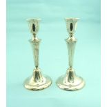 A pair of mid-20thC silver Candlesticks, hallmarked Birmingham, 1962, with vase shaped capitols