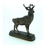 Antoine-Louis Barye (French, 1795-1875): a bronze model of a Stag, standing on oval naturalistic