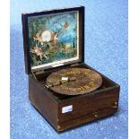A 19th century small rosewood cased Polyphon, bearing plaque 'Douglas & Co, South Street, Moorgate