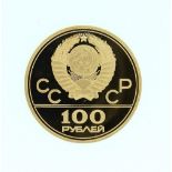 A 1980 Moscow Olympics Gold Coin, 100 Roubles, Lenin Stadium, 1978, 17.28g, in perspex coin box,