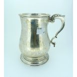 A George III silver Mug, by James Young, hallmarked London, 1771, of plain baluster form with scroll