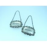 A pair of silver Wine Labels, byBohemian Jewellery Ltd., hallmarked London, 1962 & 1963, engraved '