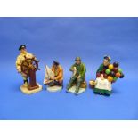 Four Royal Doulton figurines: The Old Balloon Seller, HN 1315; A Good Catch, HN 2258; Sailor's