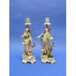 A pair of late 19thC Meissen large figural Candlesticks, modelled by Ernst August Leuteritz, she