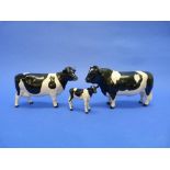 A Beswick pottery Fresian Cow, MN.1362, black and white, gloss, 4½in (11.5cm) high, together with