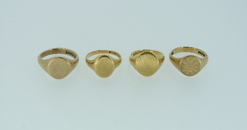 Two plain 9ct yellow gold Signet Rings, 14.7g, together with two 18ct plain yellow gold signet