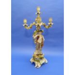 A late 19thC German Plaue porcelain figural four-light Candelabrum, the column modelled as a youth