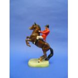 A Beswick pottery Huntsman (On Rearing Horse), MN.868, second version, brown, 9½in (24cm) high.