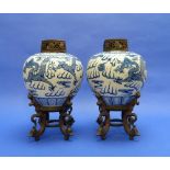 A pair of late 19thC Chinese blue and white porcelain Jars, painted with dragons chasing the flaming