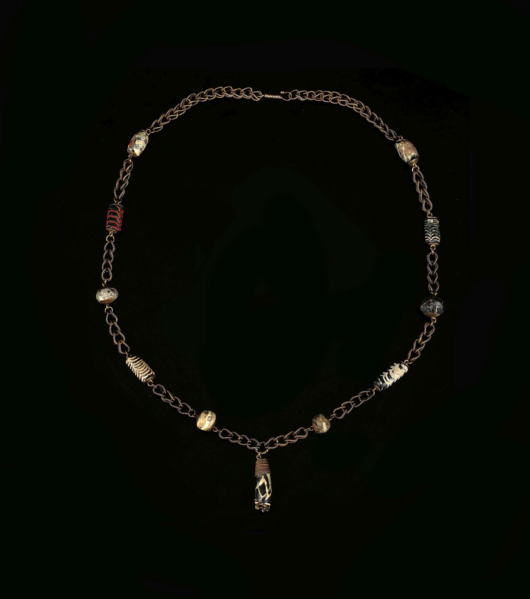 AN EARLY ISLAMIC GLASS BEAD NECKLACE Circa 8th-11th Century A.D ...