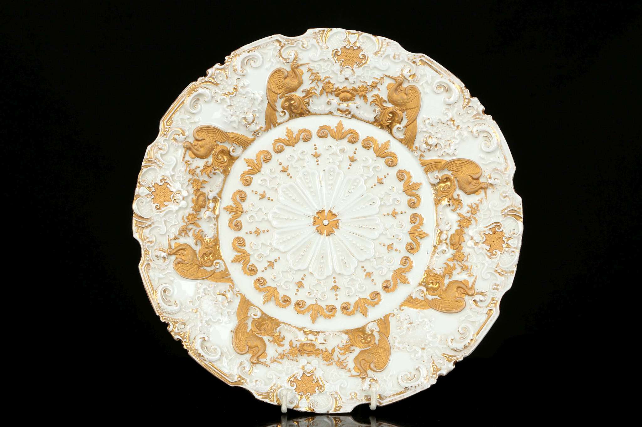 A MEISSEN CABINET PLATE, late 19th century, elaborately moulded in relief with a central rosette,