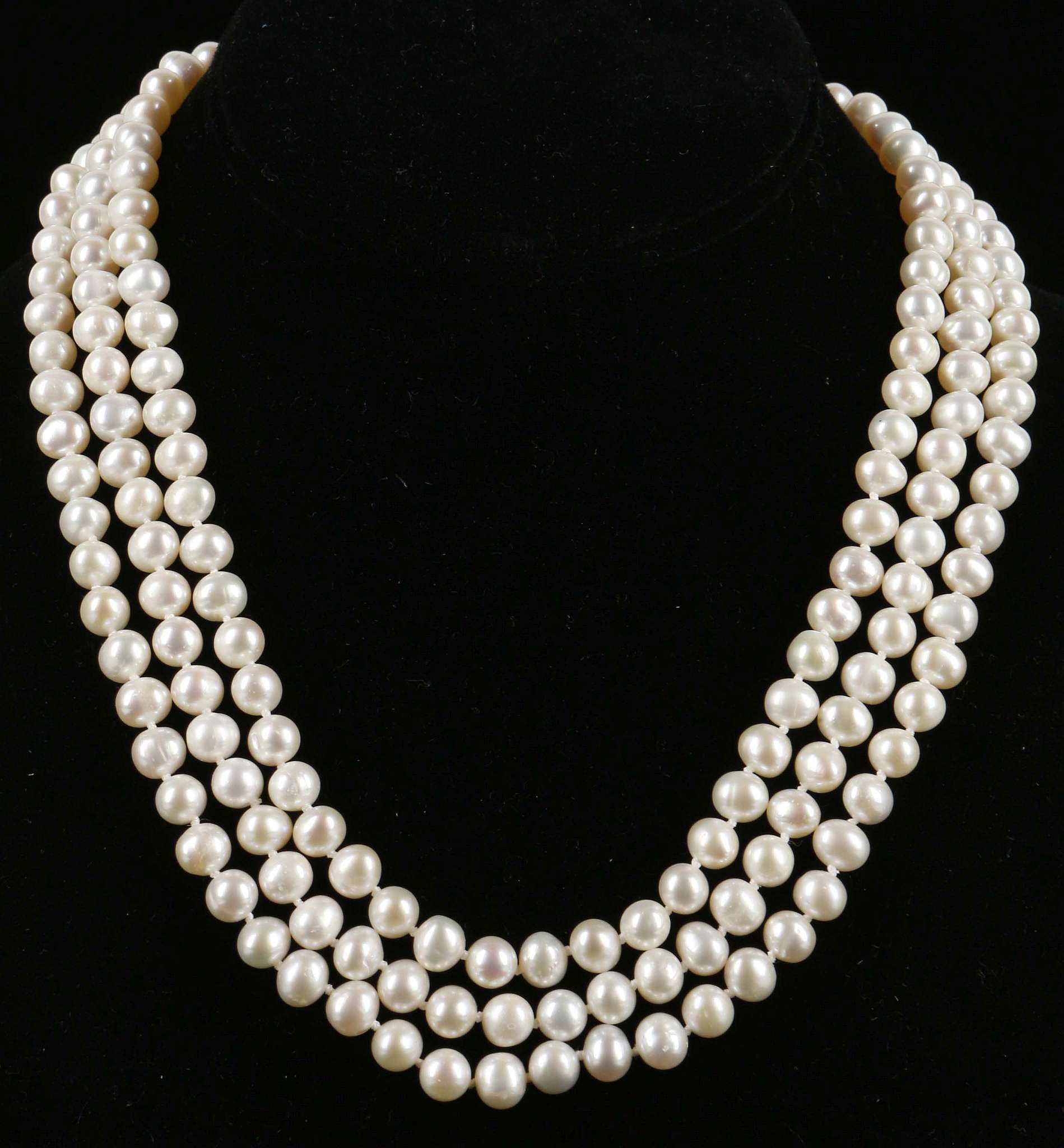 A three strand set of pearls with bar clasp. - Image 2 of 3
