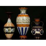 THREE DOULTON LAMBETH VASES, early 20th century, comprising a large baluster vase decorated with a